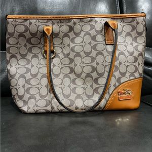 Coach purse in about great condition with a few flaws as shown in the pictures